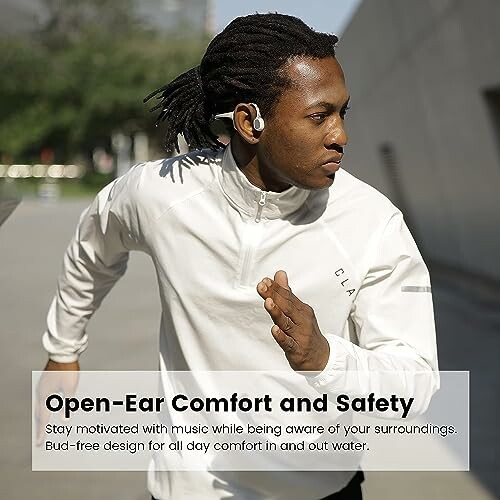 Man running with open-ear headphones for comfort and safety.