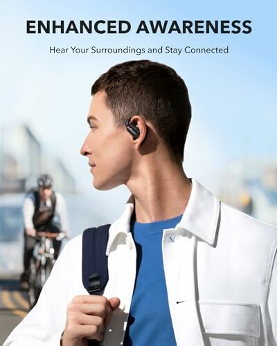 Man wearing earbuds with cyclist in background.