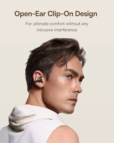 Person wearing open-ear clip-on earbuds for comfort.