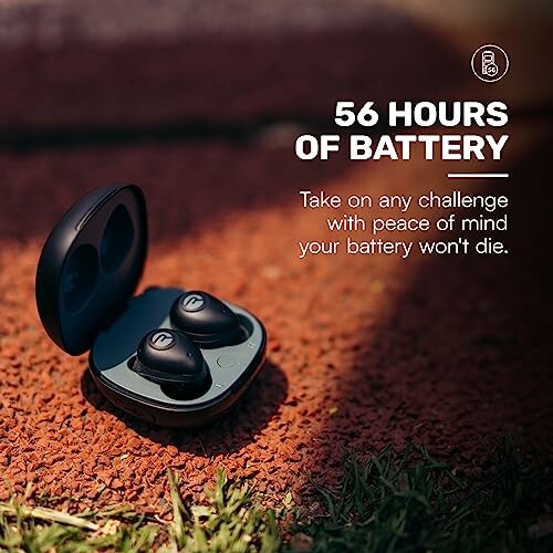 Wireless earbuds in an open charging case on a textured surface with 56 hours of battery text.