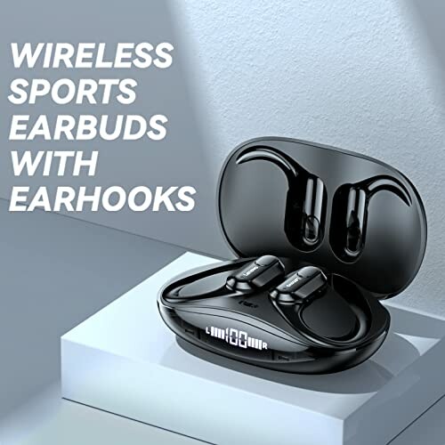Wireless sports earbuds with earhooks in charging case.
